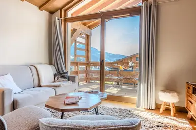a bathroom with a shower and a wooden wall at Discreet Alpine Luxury Suite Art of Living in Megève in Megève