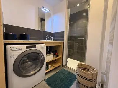 a washing machine in a bathroom with a shower at Appartement lumineux 3 pièces proche des pistes avec WiFi et parking - FR-1-572-343 in Arâches-la-Frasse