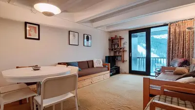 a living room with a couch and a table at Résidence Aldébaran - maeva Home - Appartement au pied des pistes 2 pièces 6 personnes - Budget MAE-9763 in Flaine