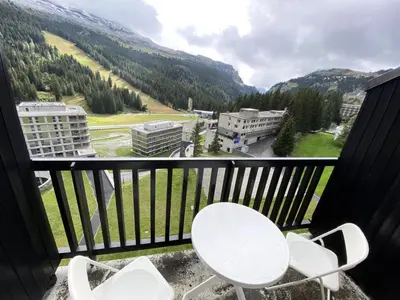 a balcony with chairs and a view of a mountain at Résidence Aldébaran - maeva Home - Appartement au pied des pistes 2 pièces 6 personnes - Budget MAE-9763 in Flaine
