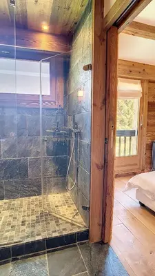 a bathroom with a shower with a glass door at Riante Colline Edelweiss - PROCHE CENTRE 3 chambres- balcon in Megève