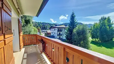 a balcony with a view of a house at Saint Michel - JAILLET - grand 3 chambres in Megève