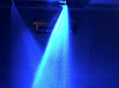 a beam of blue lights in a room at Chamonix Holiday Cromotherapy Apartment 1 in Chamonix-Mont-Blanc