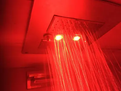 a pair of lights in a room with red light at Chamonix Holiday Cromotherapy Apartment 1 in Chamonix-Mont-Blanc