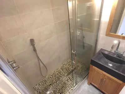 a bathroom with a shower and a sink at Chamonix Holiday Cromotherapy Apartment 1 in Chamonix-Mont-Blanc