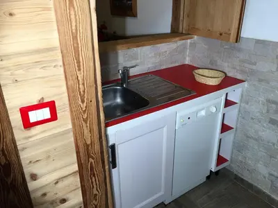 a kitchen with a sink and a counter top at Chamonix Holiday Cromotherapy Apartment 1 in Chamonix-Mont-Blanc