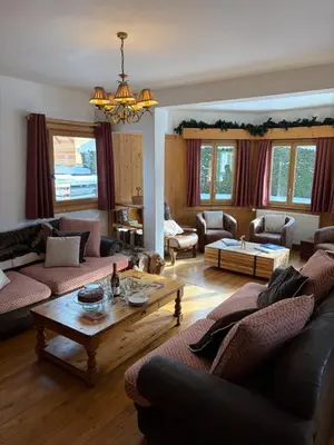 a living room with couches and a coffee table at Catered Chalet Les Clochettes in Megève