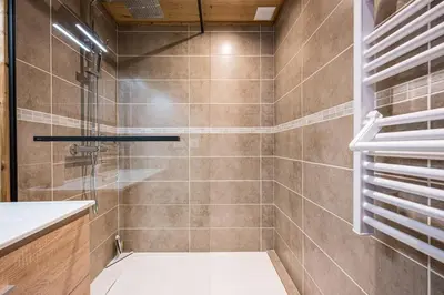 a bathroom with a shower with a glass door at Renovated Apartment 7p Argentière - Close to Slopes! in Chamonix-Mont-Blanc