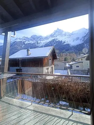 a balcony with a view of a snow covered mountain at Home in Chamonix Bossons in Chamonix-Mont-Blanc