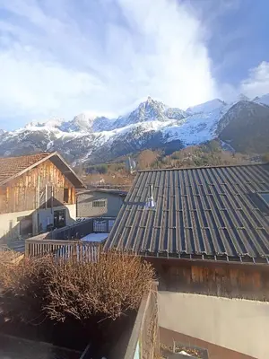 a view of snow covered mountains from the roof of a house at Home in Chamonix Bossons in Chamonix-Mont-Blanc