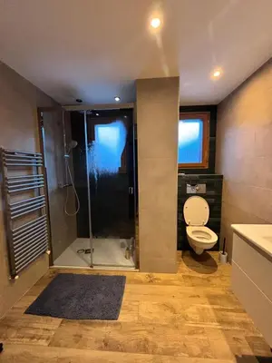 a bathroom with a shower with a toilet and a sink at Home in Chamonix Bossons in Chamonix-Mont-Blanc