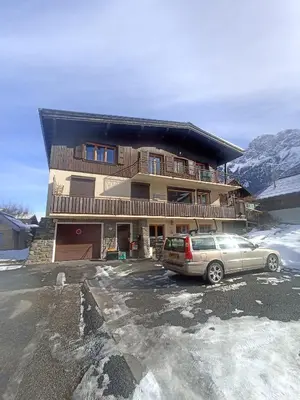 a car parked in a parking lot in front of a building at Home in Chamonix Bossons in Chamonix-Mont-Blanc