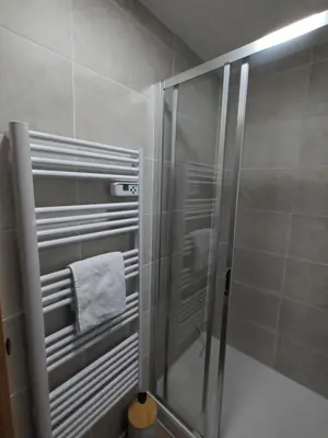 a shower stall in a bathroom with a towel at Grand Panorama-au pied du télécabine le Valléen-4pers in Saint-Gervais-les-Bains
