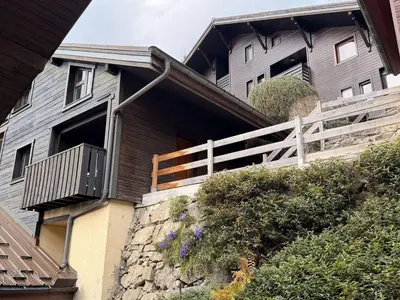 a house with a balcony on the side of it at Studio mezzanine ensoleillé, proche pistes, Les Carroz d'Arâches - FR-1-572-346 in Arâches-la-Frasse