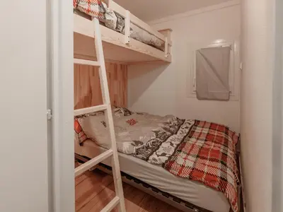 a bedroom with a bunk bed and a ladder at P Les Esserts N57 2P4 in Morillon