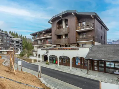 an apartment building with a balcony on a street at P Les Esserts N57 2P4 in Morillon