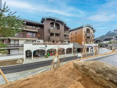 an empty street with buildings in the background at P Les Esserts N57 2P4 in Morillon