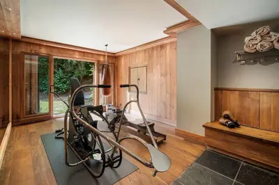 a room with a gym with a treadmill at Luxury Chalet Sauna Cinema Mont Blanc Views in Megeve in Megève