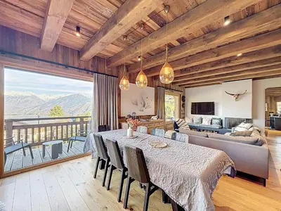 a dining room with a table and a couch at Appartement élégant 4 chambres - Combloux, proche Mont-Blanc - FR-1-560-171 in Combloux