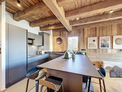 a kitchen with a large table and chairs at Appartement élégant 4 chambres - Combloux, proche Mont-Blanc - FR-1-560-171 in Combloux
