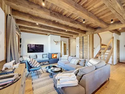 a living room with a couch and a fireplace at Appartement élégant 4 chambres - Combloux, proche Mont-Blanc - FR-1-560-171 in Combloux
