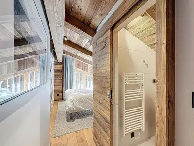 a hallway with a door leading to a bedroom at Appartement élégant 4 chambres - Combloux, proche Mont-Blanc - FR-1-560-171 in Combloux