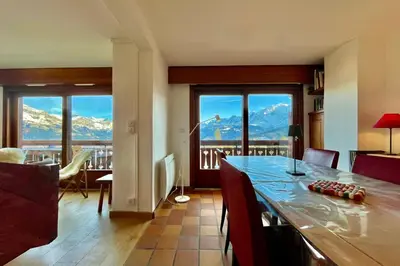 a living room with a view of a mountain at Stay in the mountains with stunning views in Combloux