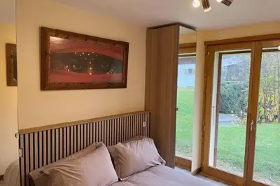 a bedroom with a bed and a window with a view at Chalet K2 in Megève