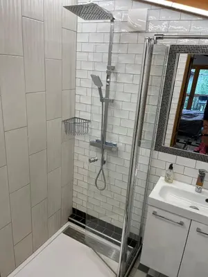 a bathroom with a shower and a sink at Chalet K2 in Megève