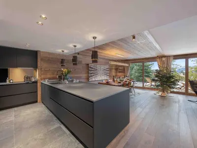 a kitchen with a large island in the middle at Megève : Appartement de luxe 115m², 6 pers, accès pistes, Wifi - FR-1-569-203 in Megève