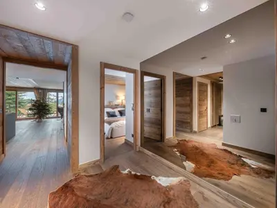 a living room with a large room with a bed at Megève : Appartement de luxe 115m², 6 pers, accès pistes, Wifi - FR-1-569-203 in Megève
