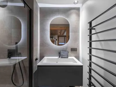 a bathroom with a sink and a mirror at Megève : Appartement de luxe 115m², 6 pers, accès pistes, Wifi - FR-1-569-203 in Megève