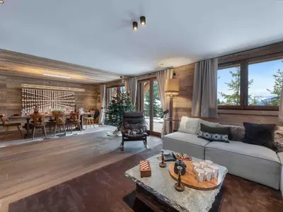 a living room with a couch and a table at Megève : Appartement de luxe 115m², 6 pers, accès pistes, Wifi - FR-1-569-203 in Megève