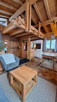 a living room with a couch and a table at Chalet Inouk 4 people Chamonix center in Chamonix-Mont-Blanc