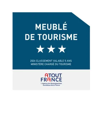 a blue sign with white stars and the words vehicle de tourism at Les Carroz - Rénové - Au cœur de la station - 4 pers in Arâches-la-Frasse