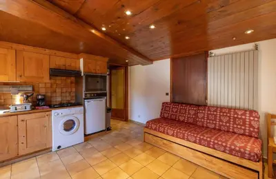 a kitchen with a red bench in a room at Appartement Le Daguet in Sallanches