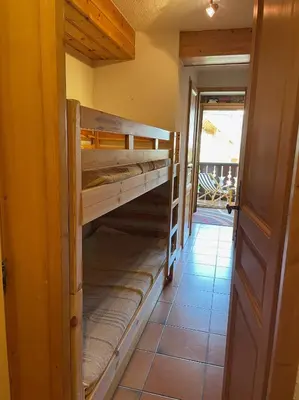a hallway with bunk beds in a house at Duplex with fantastic view 3 bedrooms 7-9 pers in Arâches-la-Frasse