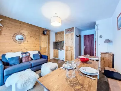 a wooden table and chairs in a room with a window at Studio Topaze-1 by Interhome in Saint-Gervais-les-Bains