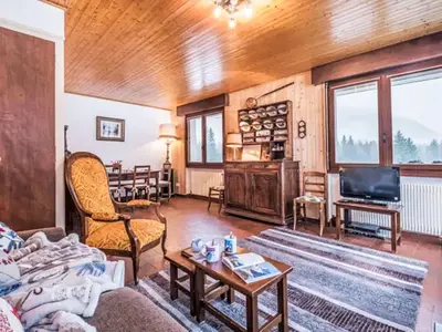 a view from a balcony of a snow covered mountain at Apartment Le Bois du Bouchet-8 by Interhome in Chamonix-Mont-Blanc