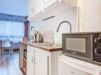 a kitchen with a sink and a microwave at Apartment Le Diorama-4 by Interhome in Saint-Gervais-les-Bains