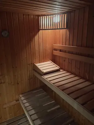 a sauna with a bench in a wooden room at Soleil in Chamonix-Mont-Blanc