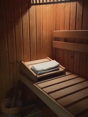 a sauna with a towel on a wooden wall at Soleil in Chamonix-Mont-Blanc