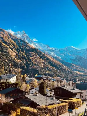 a view of a town with mountains in the background at Soleil in Chamonix-Mont-Blanc