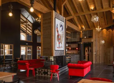a lobby with red chairs and a fire place at Veriaz - Appart 1 CH Cocon Design Confort in Megève