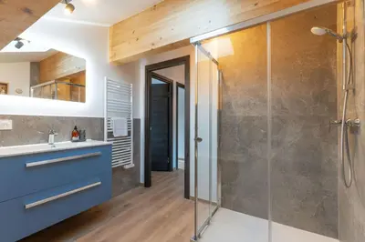 a bathroom with a shower and a sink at Babotches - Chalet 110m2 Moderne Familial 7 pax in Chamonix-Mont-Blanc