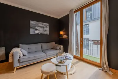 a living room with a couch and a table at Straton - Cosy 1 CH Modern Hypercentre Transport 150m in Chamonix-Mont-Blanc