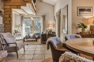 a living room with a table and chairs at Clairtemps- Charmant Chalet 168 m2 6 Pax Familial Vue in Les Houches