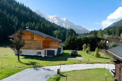 a log cabin in the middle of a mountain at Les Iles - Chalet 165m2 Vue Mont Familial 10 pax in Chamonix-Mont-Blanc