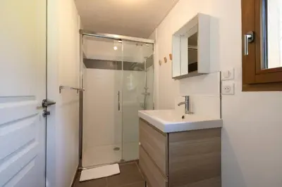 a bathroom with a shower and a sink and a sink at Les Iles - Chalet 165m2 Vue Mont Familial 10 pax in Chamonix-Mont-Blanc