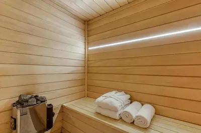a wooden sauna with a box in it at Modern Luxury Chalet BADI with Sauna - Happy Rentals in Chamonix-Mont-Blanc